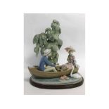 Extra-large Lladro porcelain group of a young couple in a rowing boat with swan in attendance