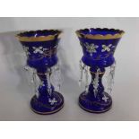 Pair of Bohemian blue glass lustres with raised enamel floral relief with gilded rim and clear