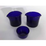 Pair of Bristol Blue glass coasters together with a further small blue glass circular bowl,