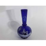 Blue Mary Gregory decorated vase with a piper sitting on a fence, 20cms tall