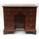 Early 18th century walnut pine lined small desk, cross banded top over a full width frieze drawer