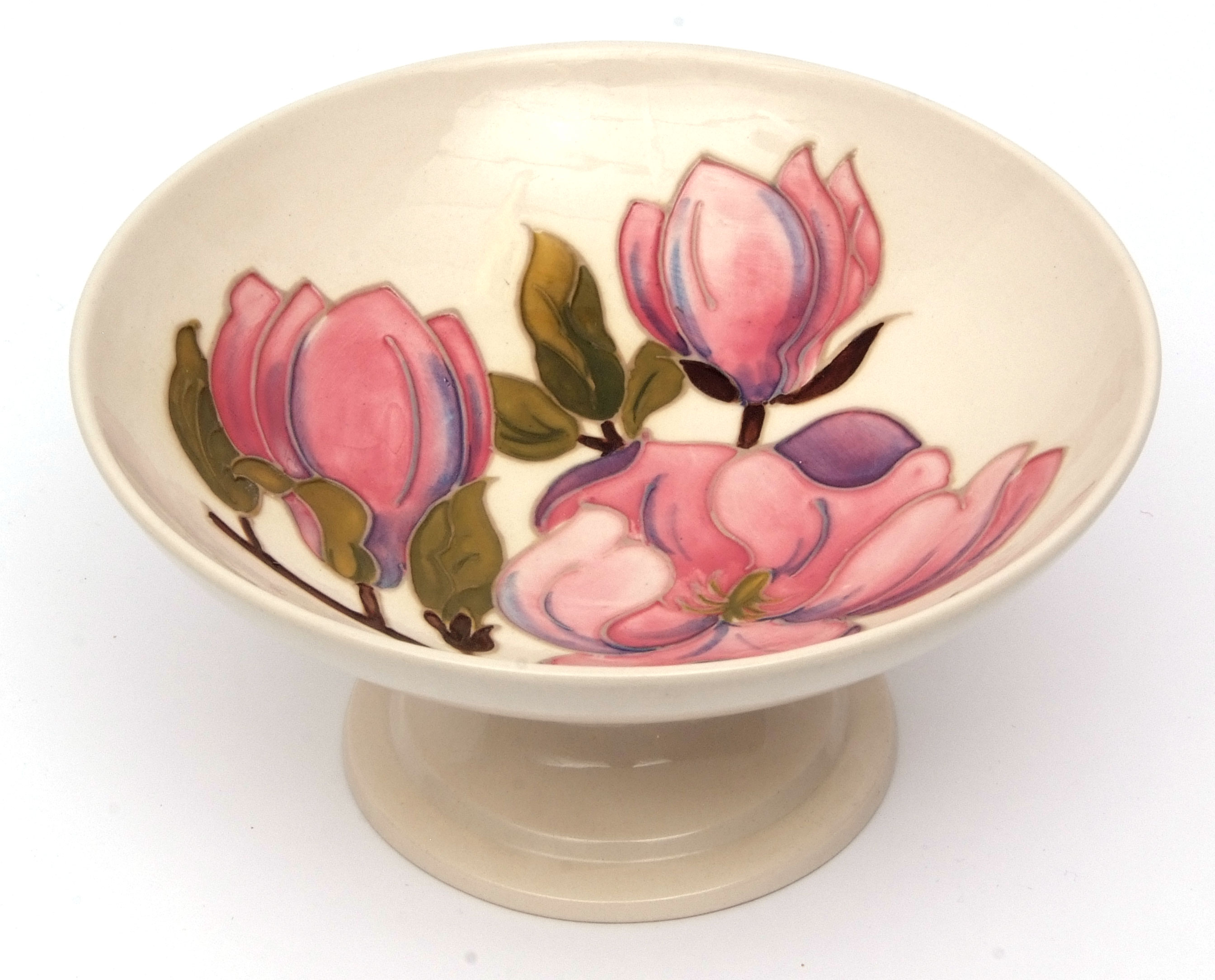 Moorcroft pedestal bowl, "Pink Magnolia" pattern to a cream ground, green hand painted initials