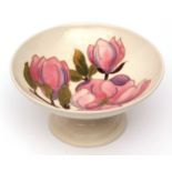 Moorcroft pedestal bowl, "Pink Magnolia" pattern to a cream ground, green hand painted initials