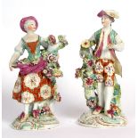 Pair of Derby candlestick figures, 23cms high, modelled as a lady and gallant in typical colours