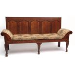 Early 19th century oak settle, the five panel back over a plain frieze and raised on plain back