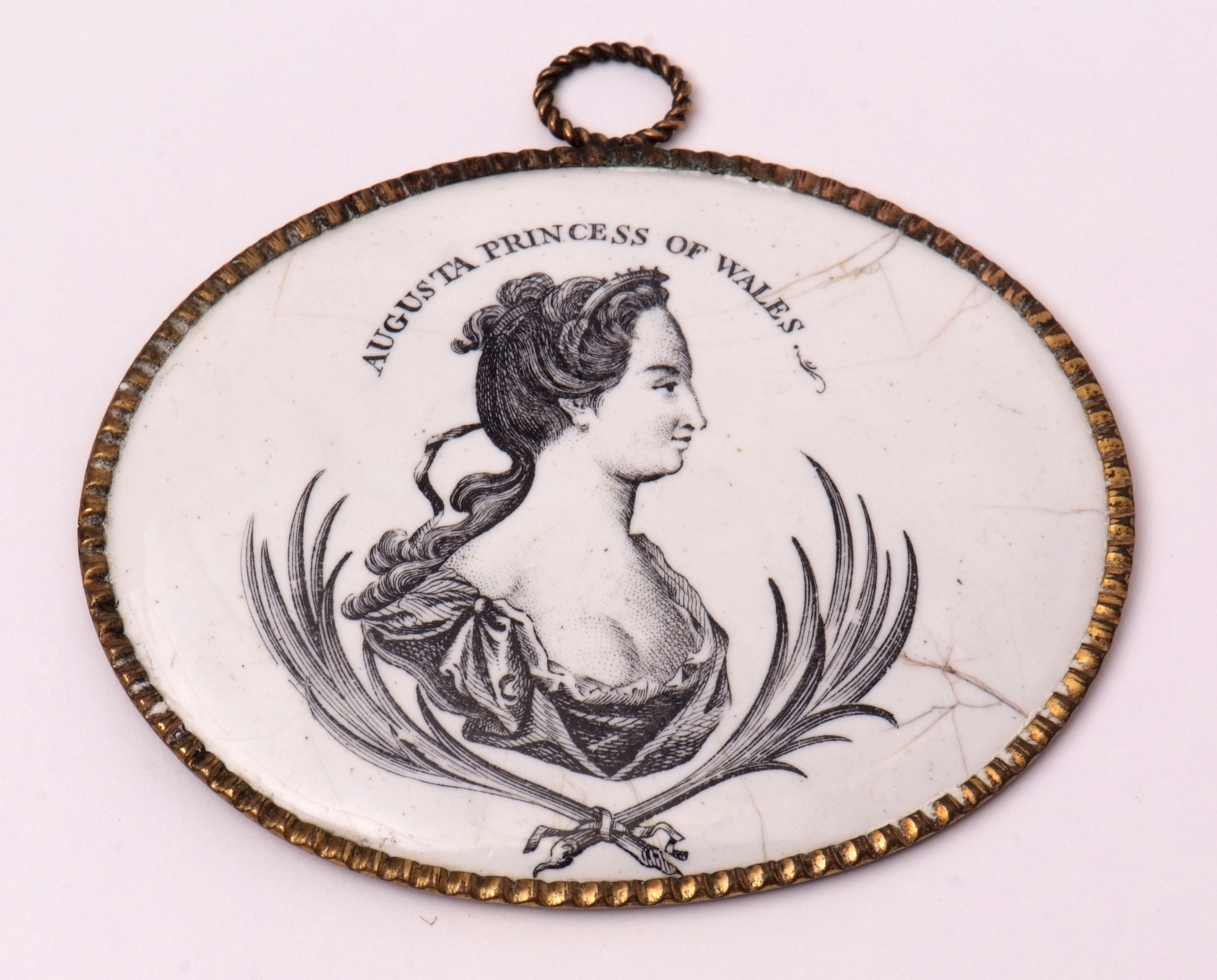 Rare mid-18th century enamel plaque, probably Liverpool, the oval plaque printed in black with a