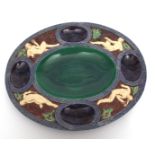 A large Majolica serving dish, possibly for Oysters, of oval shape, the centre in green surrounded