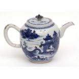 Chinese blue and white porcelain teapot decorated with lakeside temple scenes, 13cms high