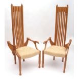 Pair of pine framed designer chairs in the style of Charles Rennie Macintosh, the high backs with