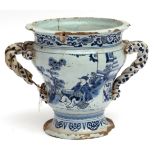 Late 17th century English (probably London) Delft urn, of inverted bell form to a circular foot,
