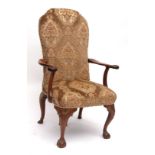 19th century mahogany armchair, the upholstered back and seat joined by splayed arms terminating
