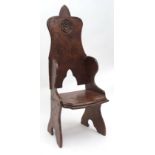 Jack Grimble oak "throne" chair, the pointed high back with an engraved Tudor rose motif below, with