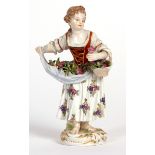 20th century Meissen figure of a flower girl, 5ins high