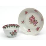 Chinese famille rose porcelain tea bowl and non-matching saucer, painted with floral sprays,