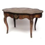 18th/19th century boulle centre table of shaped oval form, the top intricately brass inlaid to a red
