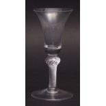 Large wine glass with inverted bell shaped bowl, twist stem and spreading circular foot, 18cms tall