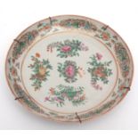 Chinese Canton porcelain shallow dish enamelled in typical palette with sprays of lotus, pomegranate