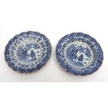 Two Chinese blue and white porcelain dishes with scalloped rims decorated to the centre with