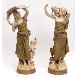 Large pair of Royal Dux painted porcelain figures of classical maidens with putti, gilded circular