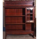 Arts & Crafts mahogany bookcase cabinet fitted with a short pediment over adjustable shelving and