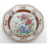 18th century famille rose dish of octagonal shape enamelled with flowering shrubs and rockwork,