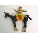 Vintage wooden articulated horse with jockey, painted in colours, 23cms long x 20cms tall