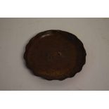 Japanese bronzed circular dish with scalloped border, with pressed centre of a warthog, 21cms diam