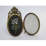 Brass oval double folding picture frame with Pietra Durer panel of snowdrops, 14cms tall