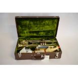 Getzen 300 series trumpet together with mouth pieces and two mufflers in a stitched rexine case