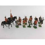 Boxed lot containing two Brittan's lead painted models of Beefeaters, two Scottish guards and