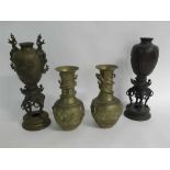 Pair of 20th century brass baluster vases with raised dragon decoration with etched design,