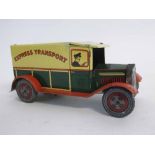 British made tin plate clockwork Express Transport van with slogan to side and top, painted in
