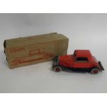 Boxed tin plate Chad Valley clockwork coupe car in black and red, 25cms long