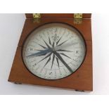 Good quality mahogany cased compass with hinged lid and circular paper dial (glass a/f), 21cms