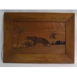 Unusual 20th century marquetry type picture depicting a tiger in a landscape, 35cms x 57cms