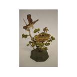 Possibly Border Fine Arts model of an Osprey feeding nesting chicks, perched in the branch, 37cms