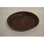 Good quality stained softwood carved-out dish, 43cms diam