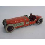 British made tin plate clockwork model of a racing car, with seated driver and steering wheel,