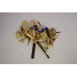 Box containing assorted ivory, bone and mother of pearl carved chess pieces, bobbins and assorted