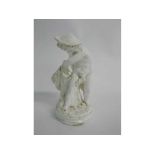 Royal Worcester type blanc de chine figure of a putti with net, 18cms tall