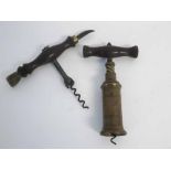 19th century brass reeded barrel corkscrew with turned handle, together with a further 19th