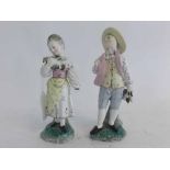 Pair of 19th century German pottery figures of a young girl holding a chicken, together with a youn