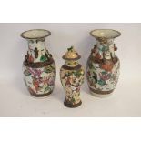 Pair of 20th century crackle glaze vases decorated with warriors and raised dragon relief,