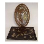 Two 20th century mother of pearl inlaid trays of oval and rectangular form, 66 and 63cms wide