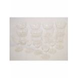 Edwardian set of six etched clear champagne glasses together with a further matching set of nine