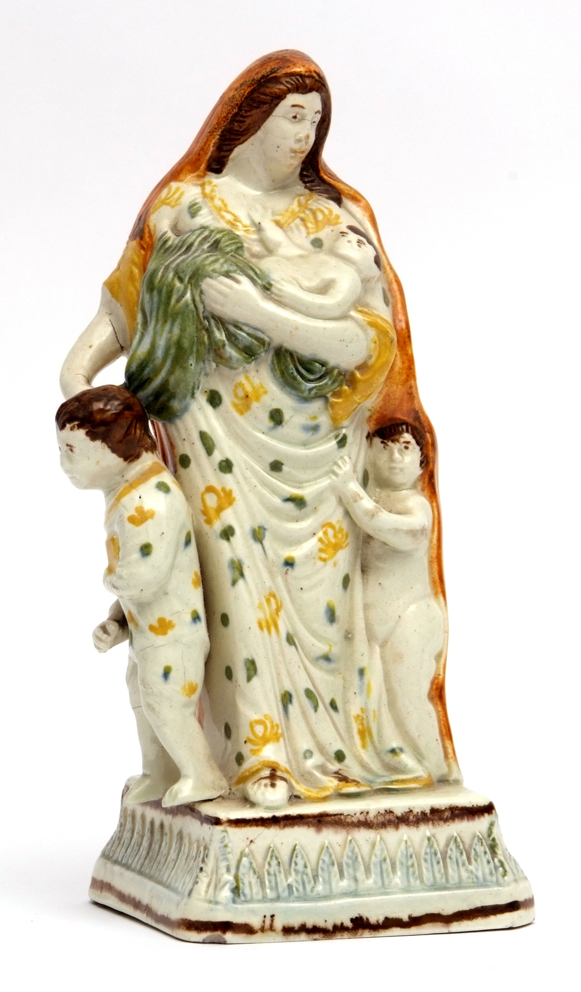 Flatware figure of Charity, modelled in typical colours, circa 1790 of a lady holding a baby with