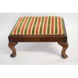 20th century walnut formed rectangular foot stool with stripped upholstered top raised on four pad