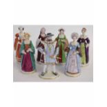 Seven Sitzendorf figures in the form of Henry VIII and his six wives (all titled on bases), 18cms