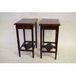 Pair of Edwardian rectangular mahogany formed side tables fitted with open work shelf, supported