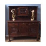 Arts & Crafts mahogany side cabinet, the raised back with glazed panel to central cupboard flanked